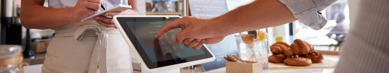 a person paying at a counter