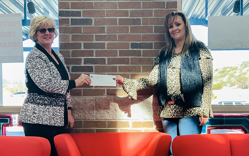 Lee Ann Tooley delivers check to Hot Springs HS