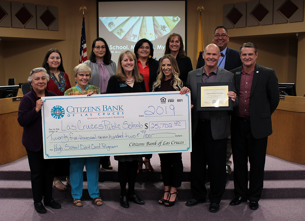 staff of Citizens Bank pose with LCPS school board and large check for donation
