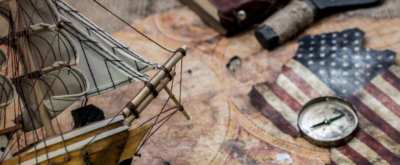 ship model and compass with nautical supplies