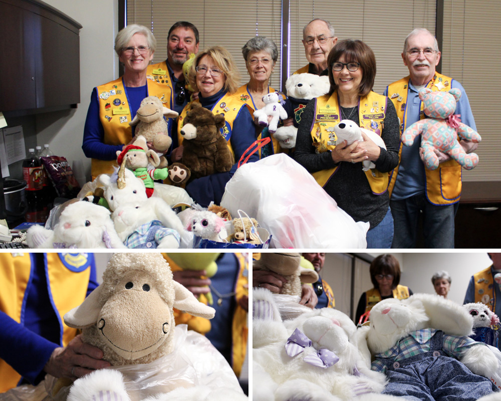 Volunteers holding donated stuffed animals